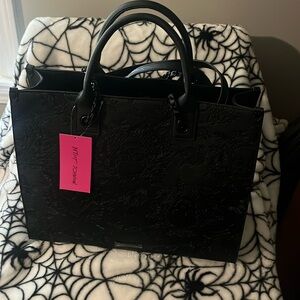 "Chic Edge: The Betsy Johnson Skull Bag"